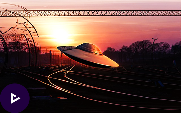 a UFO flying over tracks