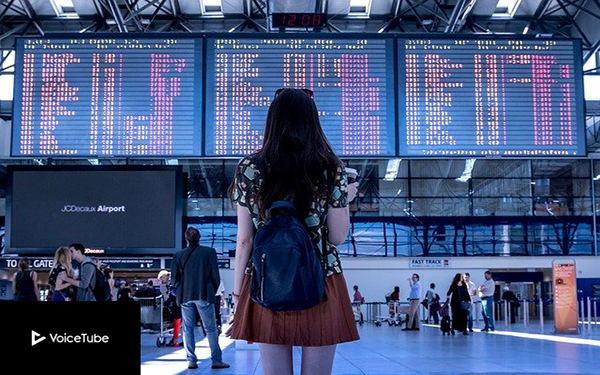 young girl standing in front of flight terminal