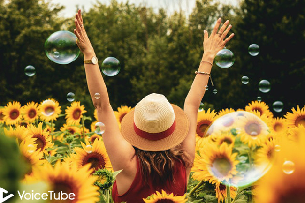 a girl who is feeling happy and free outdoors