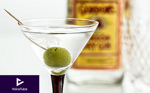 a dirty martini with an olive in it